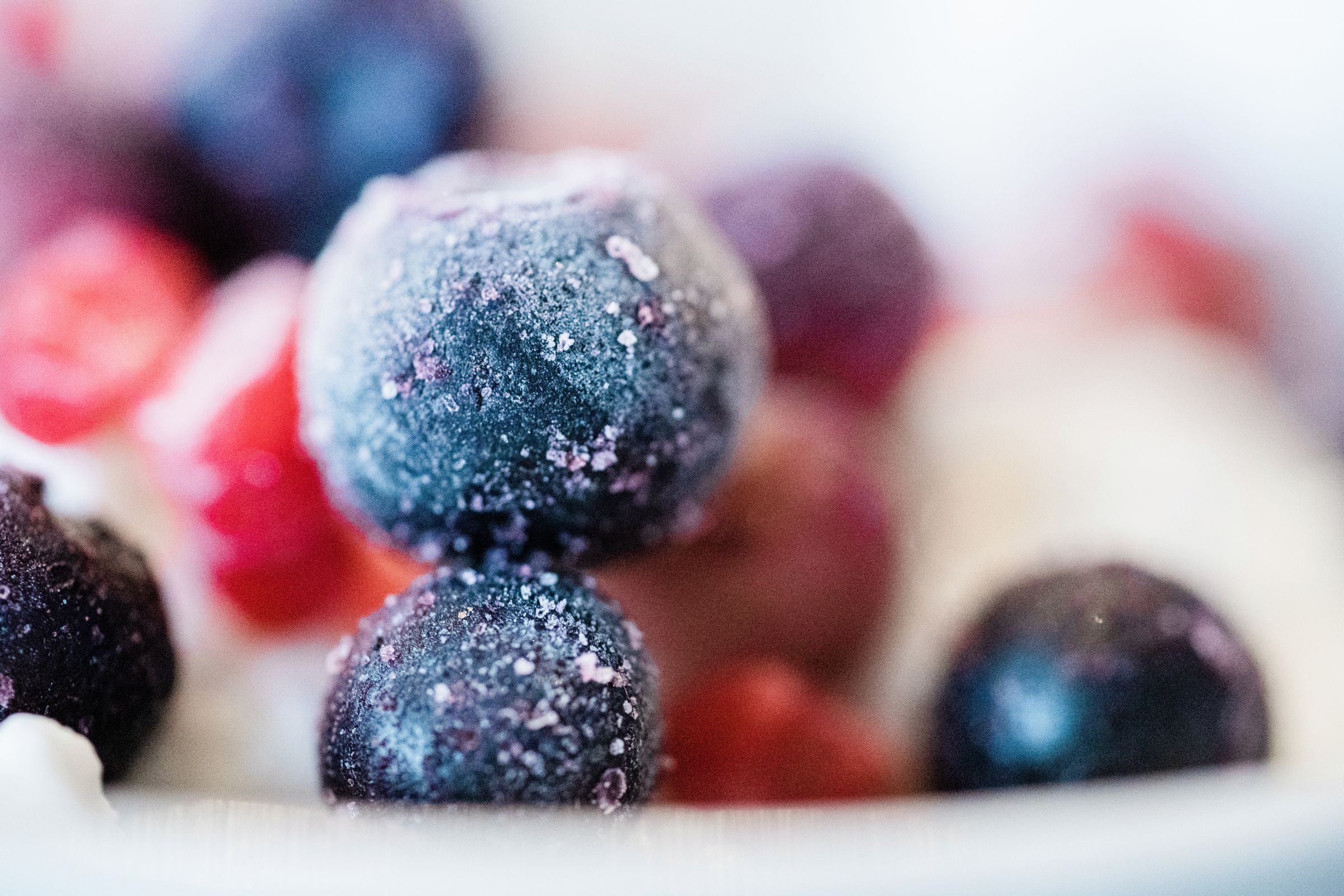Individually frozen fruit dusted with frost crystals